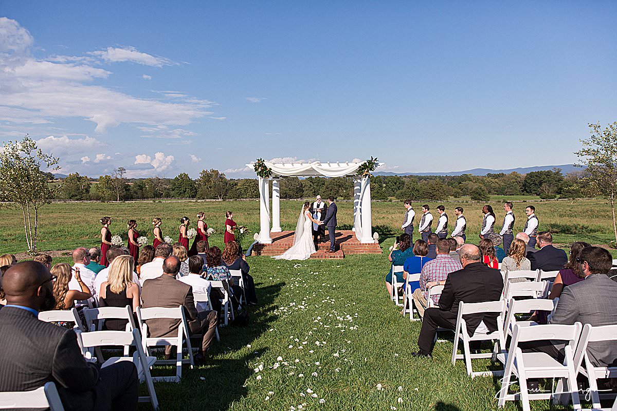 outdoor vineyard wedding ceremony | Brix & Columns Vineyard Wedding in McGaheysville VA by Harrisburg Photographer Photography by Erin Leigh