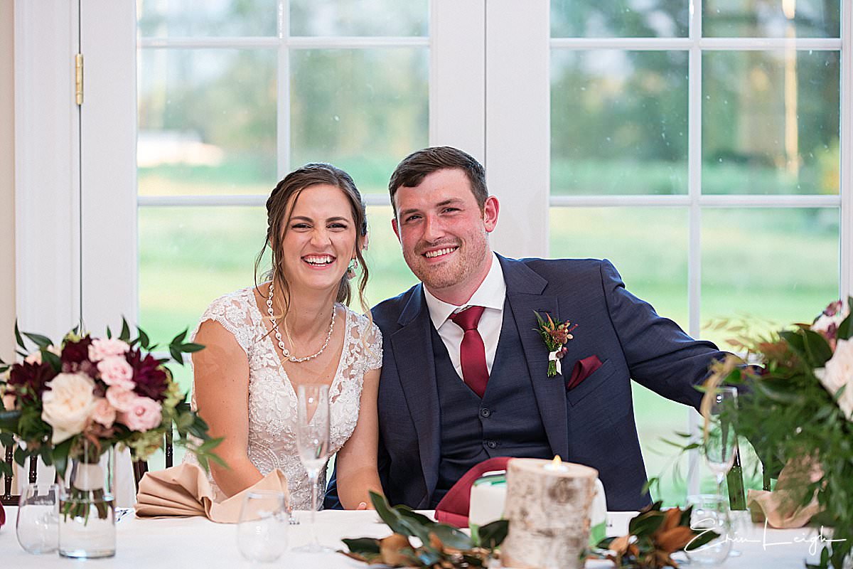 bride and groom at sweetheart table | Brix & Columns Vineyard Wedding in McGaheysville VA by Harrisburg Photographer Photography by Erin Leigh