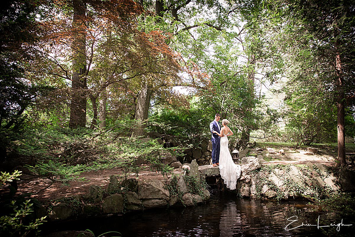 bride and groom in secret garden woods bridge over water | Lauxmont Farms Wedding in Wrightsville PA by Harrisburg Photographer Photography by Erin Leigh