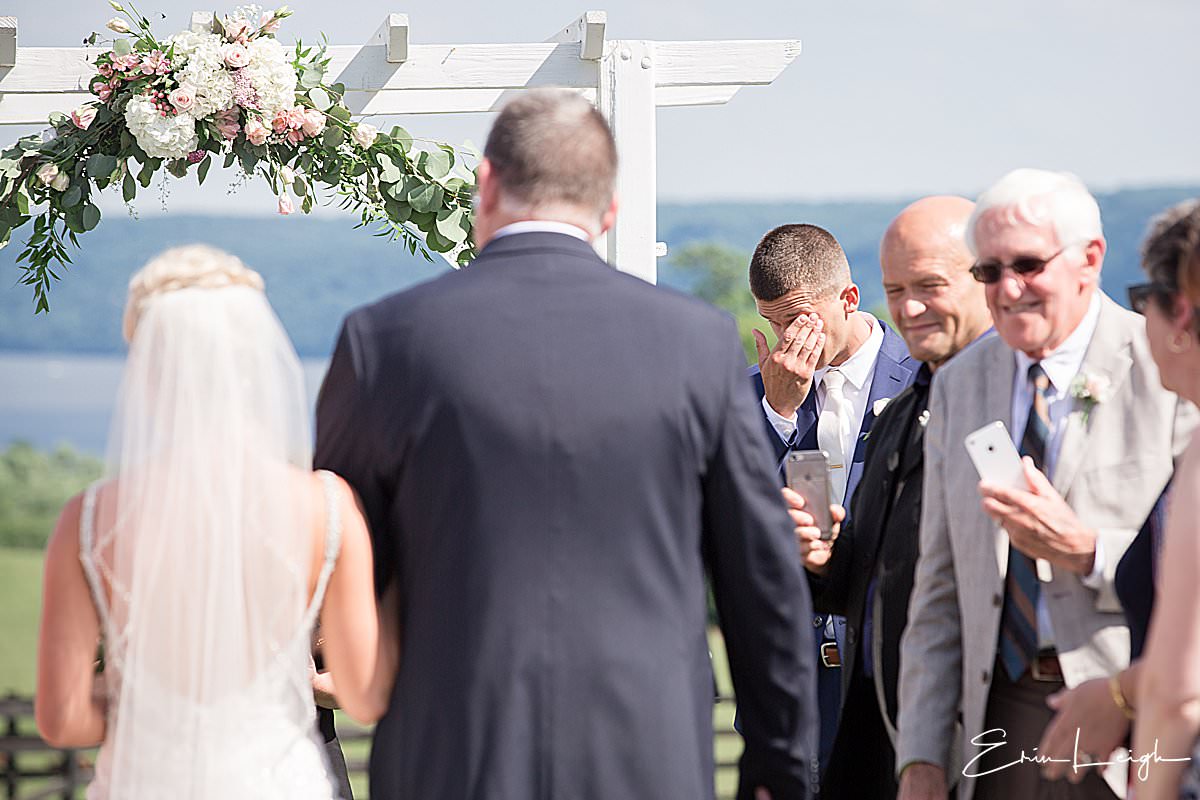 wedding ceremony processional, groom reaction, crying | Lauxmont Farms Wedding in Wrightsville PA by Harrisburg Photographer Photography by Erin Leigh