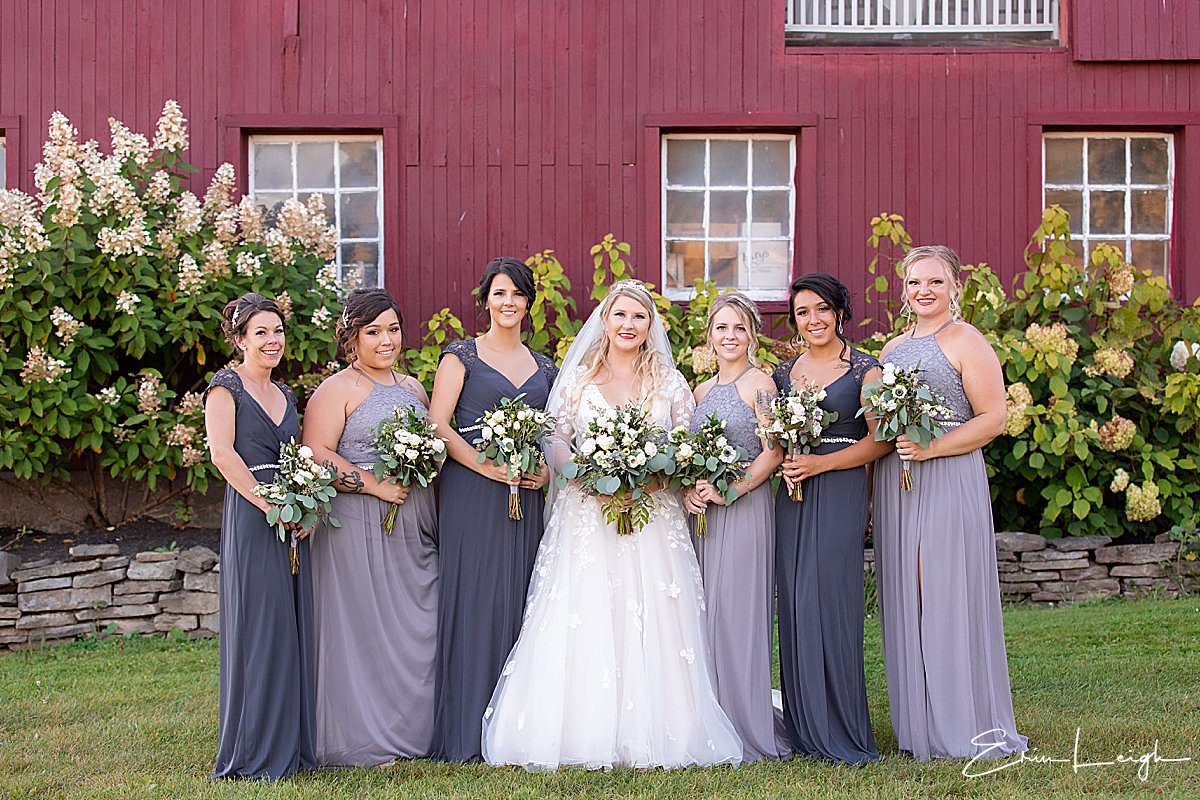 bridesmaids shades of purple and gray dresses | The Barn at Hillsprings Farm Wedding in Addison NY by Harrisburg Photographer Photography by Erin Leigh