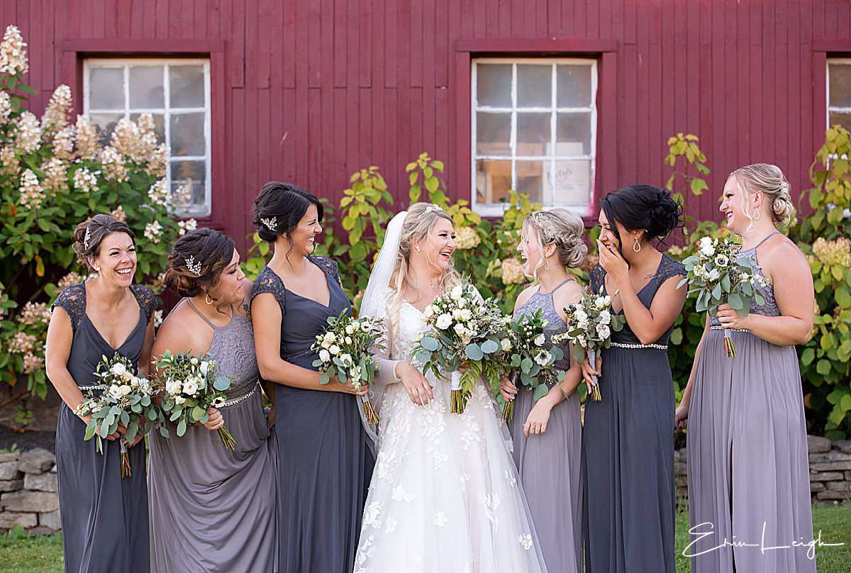 bridesmaids shades of purple dresses | The Barn at Hillsprings Farm Wedding in Addison NY by Harrisburg Photographer Photography by Erin Leigh