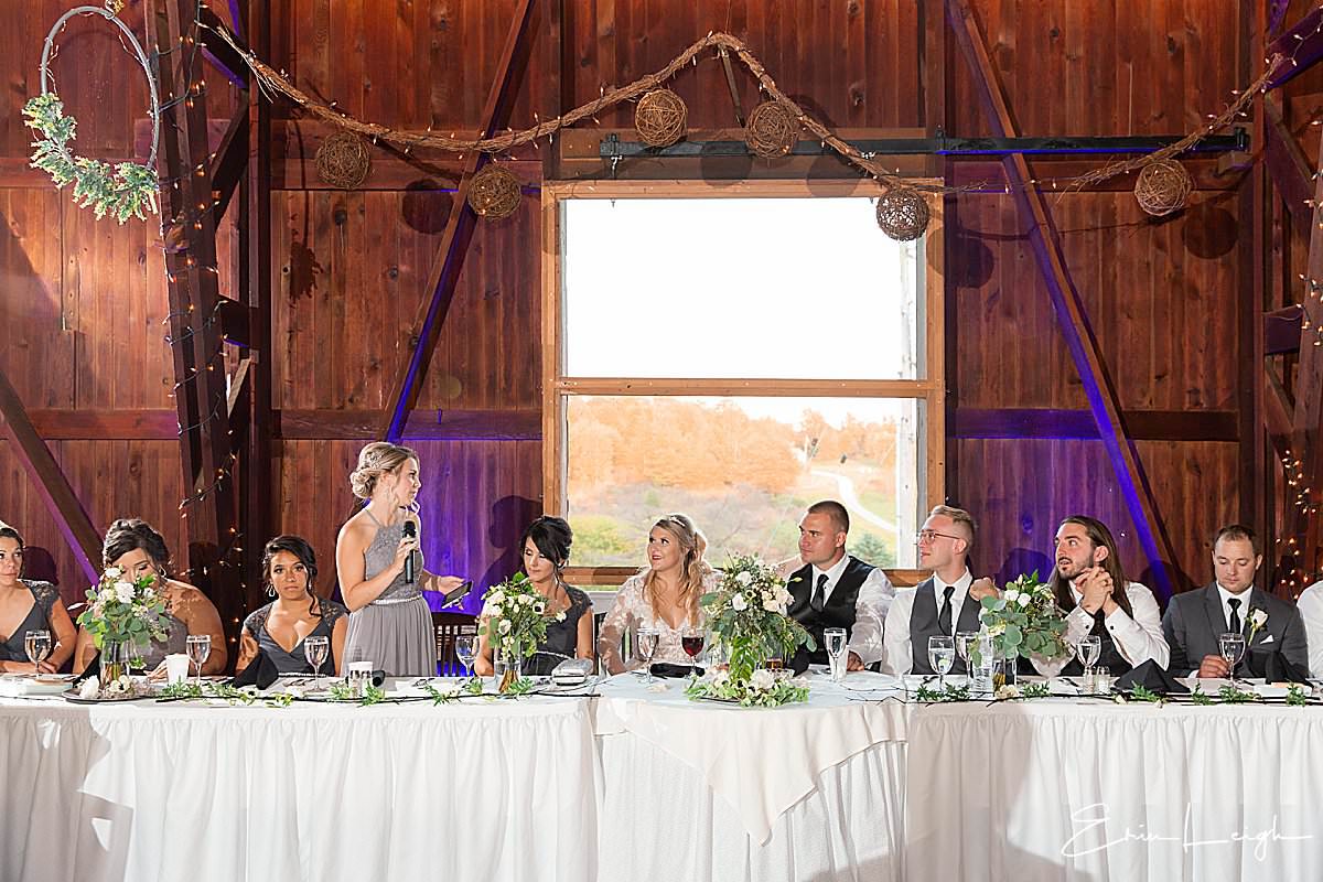 toasts in elegant barn reception venue purple uplighting | The Barn at Hillsprings Farm Wedding in Addison NY by Harrisburg Photographer Photography by Erin Leigh