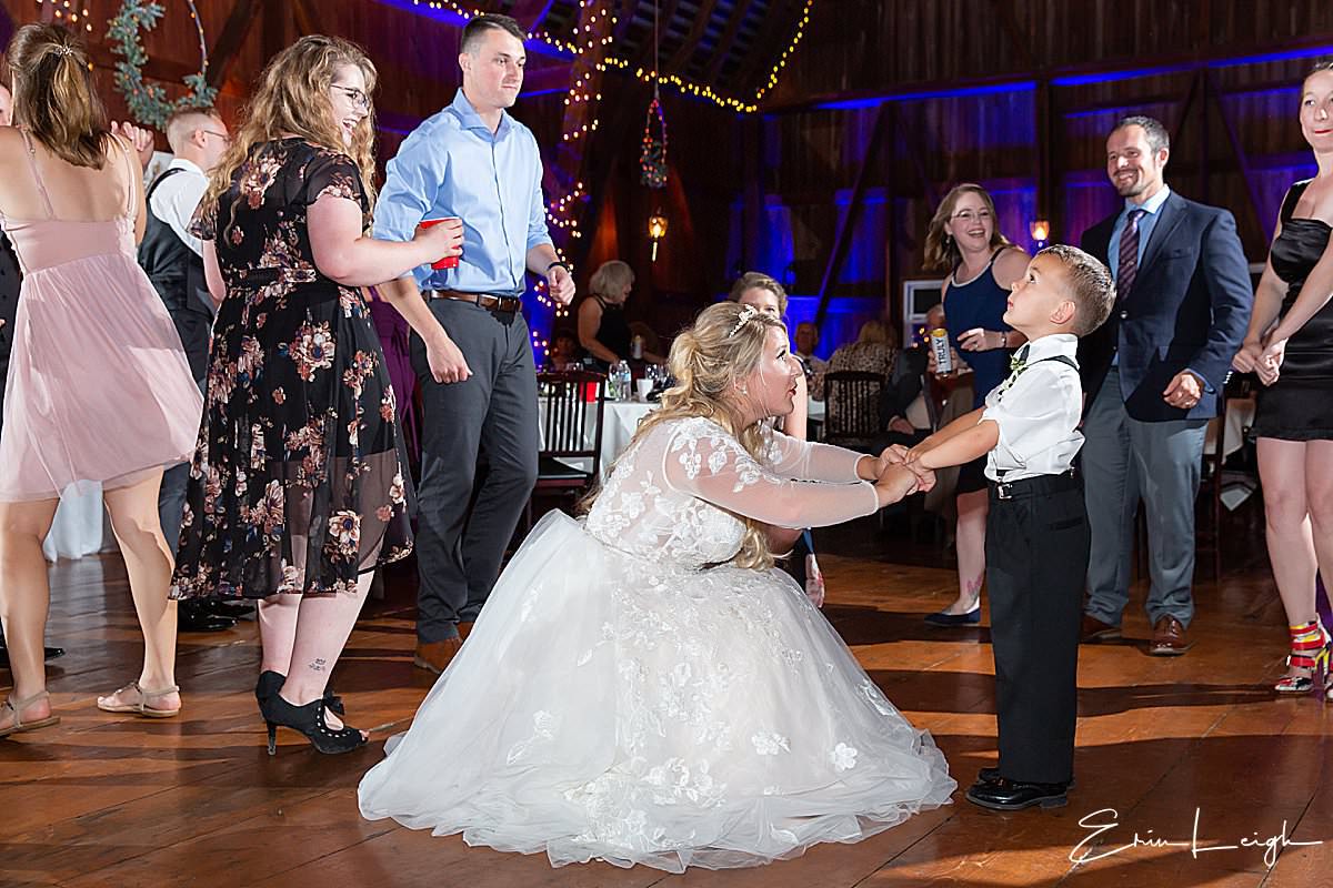 bride dancing with ringbearer | The Barn at Hillsprings Farm Wedding in Addison NY by Harrisburg Photographer Photography by Erin Leigh